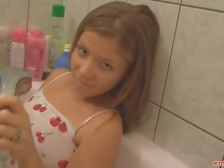 Wet teen in the bathtub